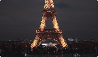 The Eiffel Tower lit up at night in Paris