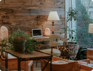 Cozy home workspace with plants and warm lighting